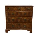 Early 18th century walnut chest of three short and three long graduated drawers, all with brass