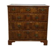 Early 18th century walnut chest of three short and three long graduated drawers, all with brass