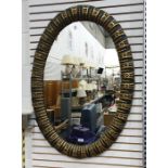 Oval wall mirror in moulded frame, 101cm x 71cm