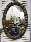Oval wall mirror in moulded frame, 101cm x 71cm