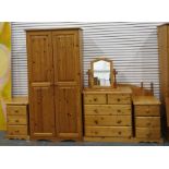 Pine two-door wardrobe, a chest of drawers, two bedside chests, two headboards and a dressing