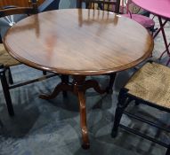 19th century mahogany snap-top circular centre table with moulded edge, on turned pedestal to