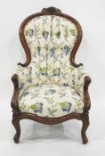 Victorian mahogany scoop back armchair, the cresting with fruiting vine, button upholstered and