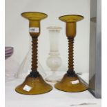 Pair engraved amber glass table candlesticks, each with spirally wrythen column and on dome-shaped
