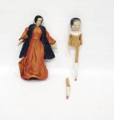 Painted wooden doll and a fabric covered early costume doll in Middle Eastern dress with metal