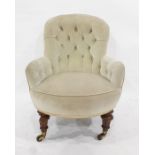 Late Victorian button-back grey upholstered chair on turned and carved supports, to brass caps and