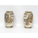 Pair of Japanese pottery vases, each shouldered and panelled, decorated with scenes of warriors