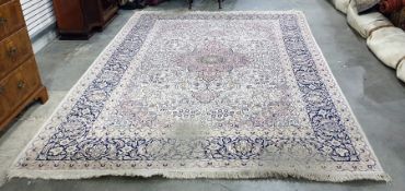 Persian rug, the cream ground with pink ground cen