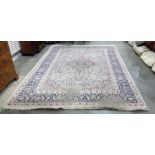 Persian rug, the cream ground with pink ground cen