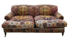 George Smith Ltd sofa in the manner of Howard of London, ethnic covering, turned supports, brass