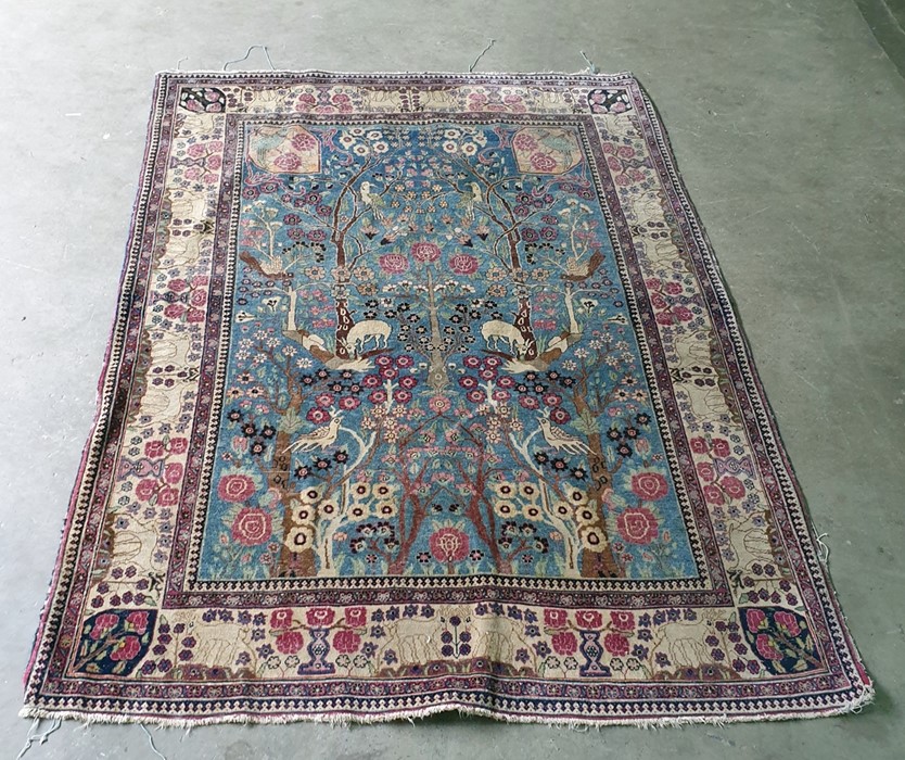 Blue ground Persian rug with Tree of Life decorati