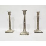 Three Victorian silver candlesticks as Corinthian