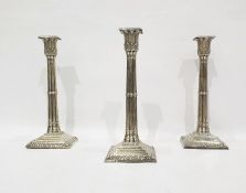 Three Victorian silver candlesticks as Corinthian