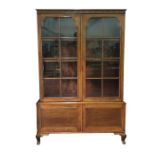 20th century mahogany bookcase cabinet with two astragal glazed doors enclosing adjustable shelves