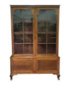 20th century mahogany bookcase cabinet with two astragal glazed doors enclosing adjustable shelves