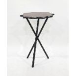 Tartan-topped ebonised wood tripod table with faceted supports, the top with scalloped edgeCondition