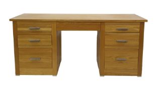 Modern oak desk with seven assorted drawers, 180cm x 80.5cm