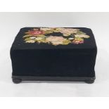 Black velvet and woolwork tapestry rectangular footstool embroidered with wreath of roses