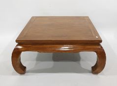 Modern Eastern hardwood square-top coffee table on shaped supports, 102cm x 45cm