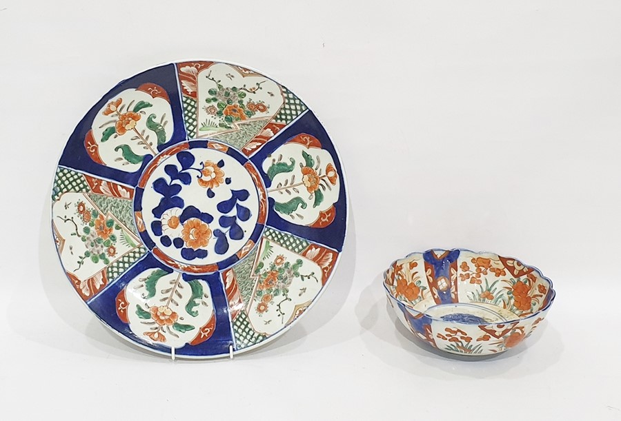 Large Japanese Imari porcelain charger with typical decoration, in fan-pattern reserves, in iron-