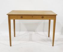 Oak side table, rectangular and having single frieze drawer, on circular tapering supports