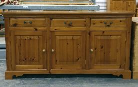 20th century pine sideboard, the rectangular top above three drawers and three cupboard doors, on