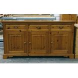 20th century pine sideboard, the rectangular top above three drawers and three cupboard doors, on