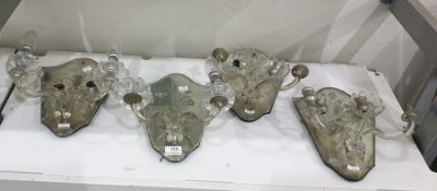 Set of four Victorian cut and engraved glass wall brackets, having shield-shaped backs, each