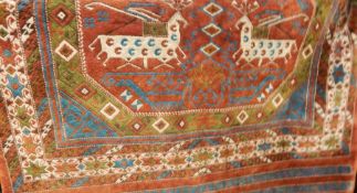 Turkish silk rug, the central field red ground wit