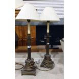 Pair of brass table lamps,with turned brass  cylindrical columns on square base, raised upon bun