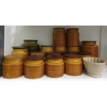 Large collection of Hornsea 'Saffron' pattern pottery storage jars, cylindrical, with wooden covers,