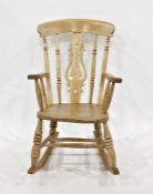 Elm seated rocking chair with carved and shaped backsplat, turned supports, rocker base