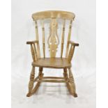 Elm seated rocking chair with carved and shaped backsplat, turned supports, rocker base