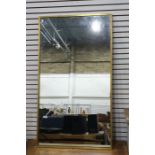 Rectangular mirror in brass frame, 70cm x 125cm Condition ReportSome pitting/ dark spotted marks