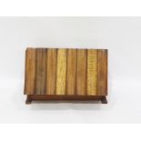 Exotic figured wood box by H J Gore, the fall front faced as multiple books, each with exotic wood