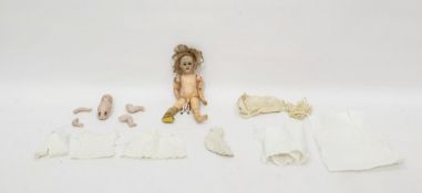 Bisque headed doll with brown sleeping eyes, open mouth, moulded upper teeth, pierced ears, having