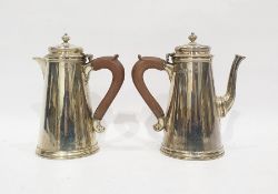 Edwardian silver coffee pot and hot water jug, the conical bodies with stepped bases, wooden