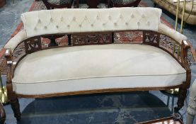 19th century mahogany framed sofa with cream ground button-back, cream upholstered seat, carved