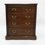 Miniature mahogany chest of two short over three long graduated drawers, on bracket feet, 55cm x