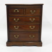 Miniature mahogany chest of two short over three long graduated drawers, on bracket feet, 55cm x