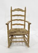 Beech framed ladderback rocking chair with turned stretchers