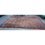 Red ground Eastern rug with allover foliate decora
