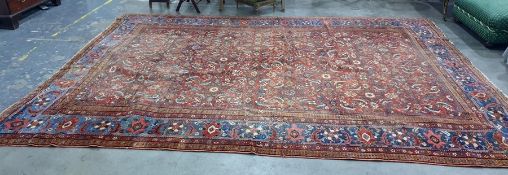 Red ground Eastern rug with allover foliate decora