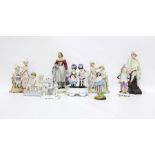 19th century continental porcelain figure of traveller, bisque and other figures including fairing