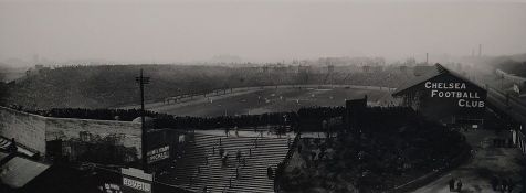 Black and white photograph of Chelsea Football Ground , taken in 1950's 1960's , the players mid-