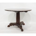 Regency style mahogany circular breakfast table, the circular top on tapered column and concave