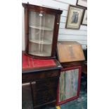 Reproduction mahogany serpentine-fronted bureau with four drawers, bracket feet and a wall hanging