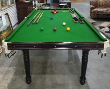 Snooker table with assorted balls, cues, triangle, scorer, etc