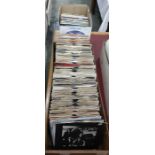 Case of 45rpm singles to include examples by Wings, UB40, Tom Robinson Band "Up Against the Wall",