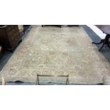Light green ground rug with foliate decoration, cr